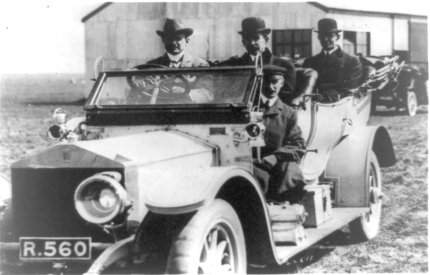 CS Rolls driving one of his cars with the Wright brothers and his chauffeur as passengers. Shellbeach May 1909.